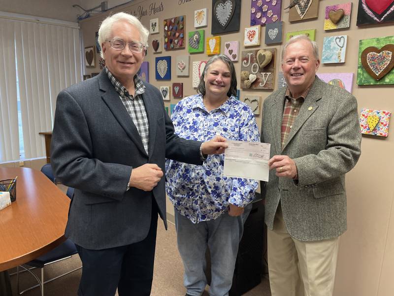 Starved Rock Country Community Foundation Board Chair Reed Wilson, left, with Braveheart Children’s Advocacy Center Executive Director Jackie Diediker and SRCCF board member Michael Stutzke of Princeton.