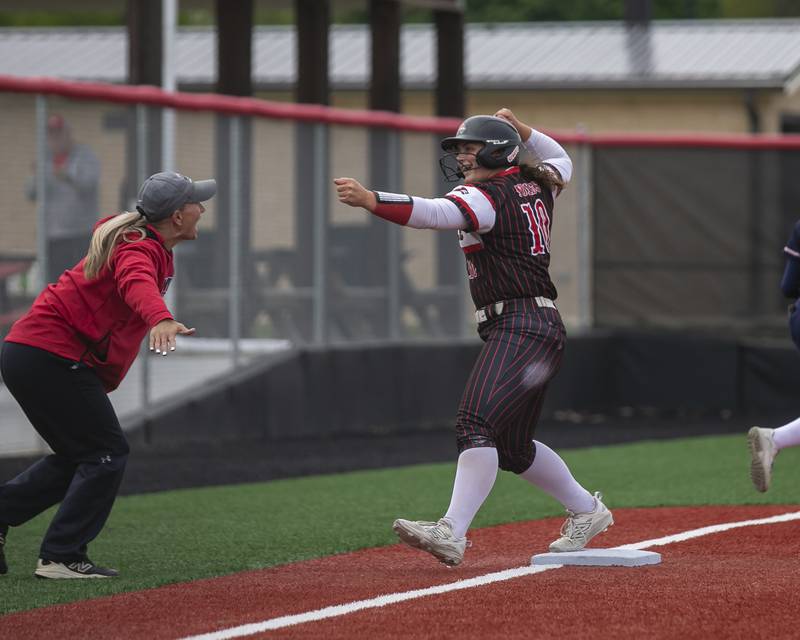 Yorkville's Kayla Kersting (10) celebrate her triple during softball game between Oswego at Yorkville. May 5, 2026 in Yorkville.