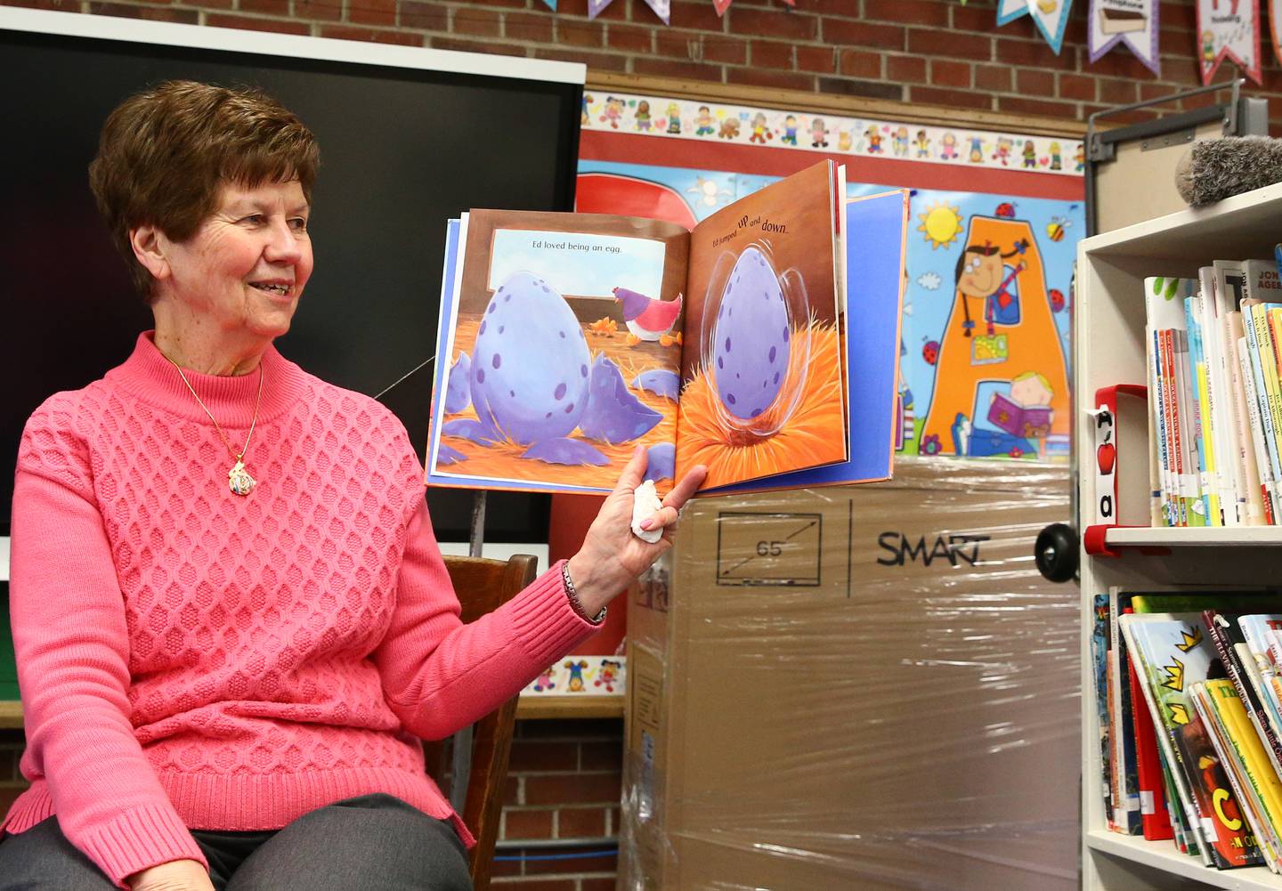 Eleanor Walker, reads an Easter book to her preschool  class on Friday, April 15, 2022 at Douglas School in Princeton.