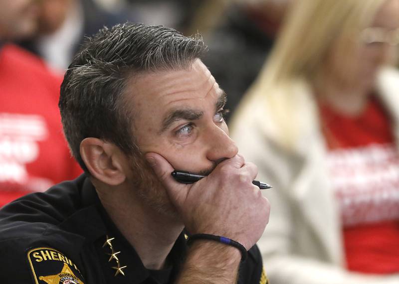 McHenry County Sheriff Robb Tadelman listens to public comments at McHenry County's Law and Government Committee meeting on Tuesday, Jan. 31, 2023, at the McHenry County Administration Building. The committee held a public comment period before it considered a resolution to oppose Illinois' newest gun ban and support its repeal.