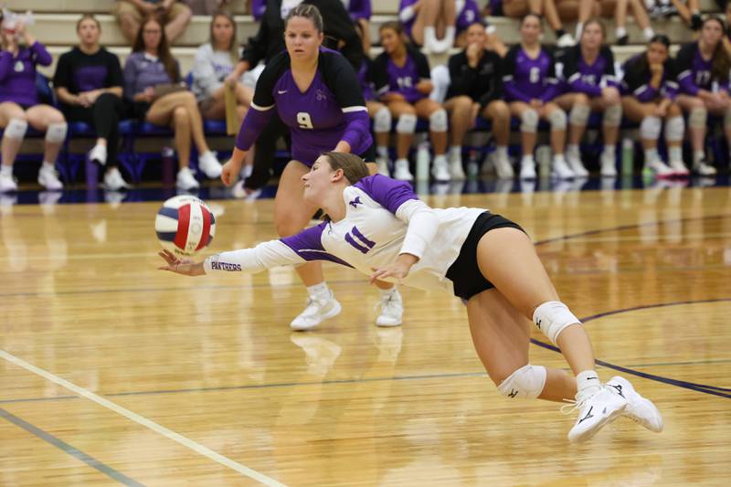 Manteno's Morgan Derrico dives to save a tipped ball during the Panthers' victory in three sets, 19-25, 25-19, 25-21, over Peotone on Tuesday, Sept. 23, 2025.