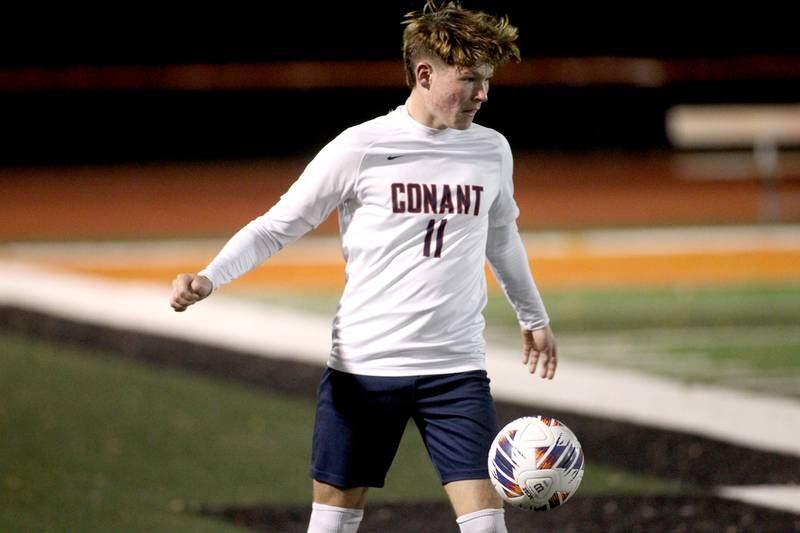 Conant’s Carson Belcher gets control of the ball during a 3A St. Charles East Sectional semifinal against Glenbard East on Wednesday, Oct. 26, 2022.