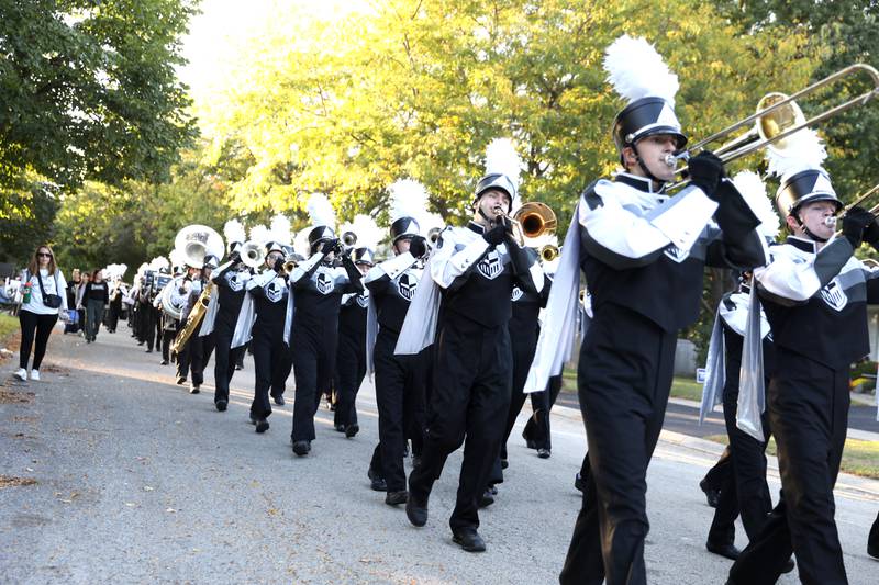 The Kaneland High School Marching Band performs on Wednesday, Oct. 2, 2024 during the school’s homecoming parade in Elburn.