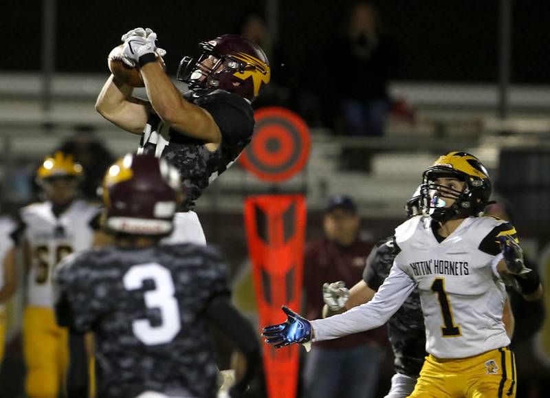 Richmond-Burton's Luke Rendtorff intercepts a pass intended for Harvard's Daniel Rosas during a Kishwaukee River Conference football game on Thursday, Oct.12, 2023, at Richmond-Burton High School.
