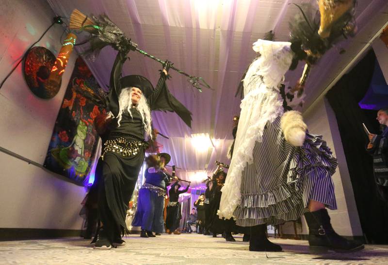 Jeri Etscheid (left) of The Village Witches performs on Wednesday, April 30. 2025 at Crafty Eclectic in La Salle. The witches performed five dances as a part of a world wide witches dance to honor the original Wolfshager Hexenbrut, a meaning "The Wolf Hunter's Coven," a group of women from Germany known for the choreographed with dance. The witches also dedicated their performance to their friend RJ who passed away recently.