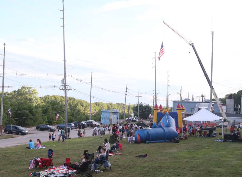 Children play in the fun zone before the fireworks on Wednesday, July 3, 2024 along Water Street in Peru.