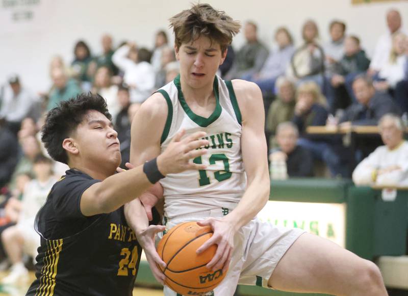 St. Bede's Graham Ross grabs a rebound over Putnam County's Alan Castro during the Class 1A Regional quarterfinal game on Monday, Feb. 23, 2026 at St. Bede Academy.