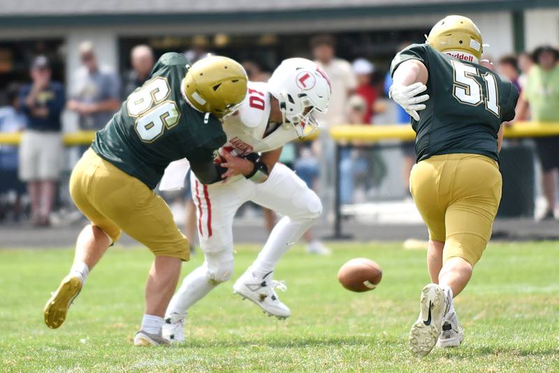 Bishop McNamara's Robbie Smith, left, forces Lawrenceville's Isaac Vennard, center, to fumble as fellow Fightin' Irish Mason Hemenover rushes to recover the ball during a game at Bishop McNamara Saturday, Aug. 30, 2025.