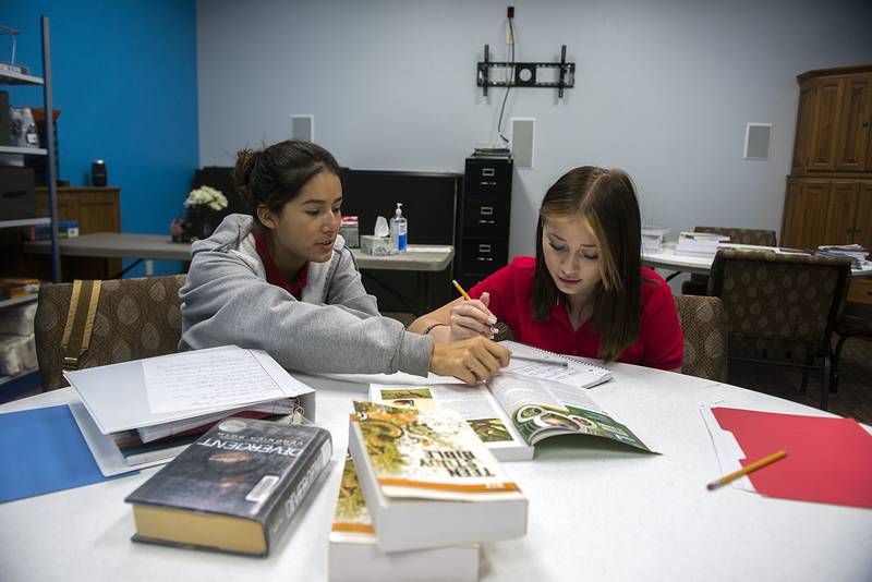 Willow Torres (left) and Calyn Weidel, eighth graders at Sauk Valley Christian Academy, work together on an assignment Wednesday, Sept. 7, 2022.