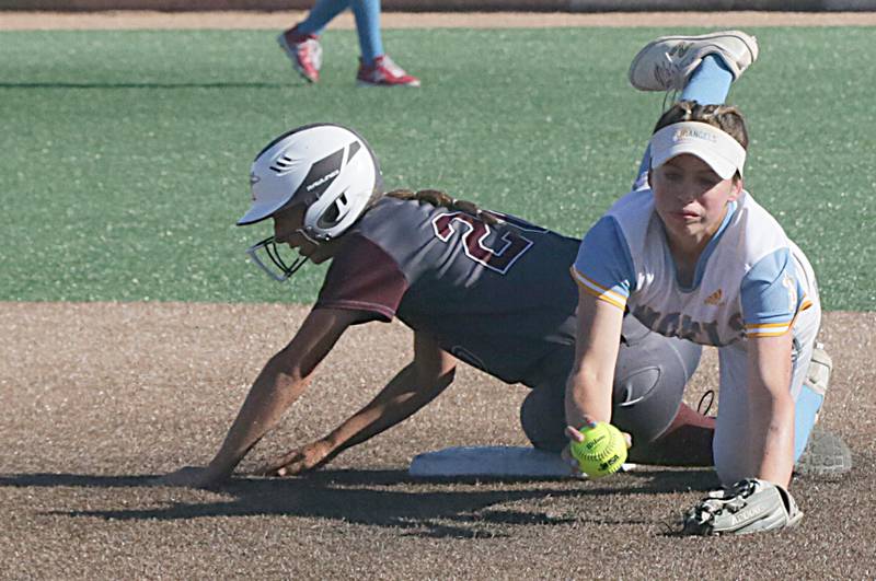 Joliet Catholic’s Morgan Bruno, gets the force out of Taylor Ridge’s Kori Needham while tripping over the bag.