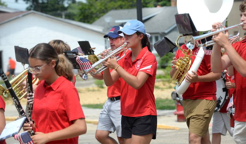 Andy and Sarah Eckardt play with the Oregon Junior/Senior High School band during the Let Freedom Ring parade on Friday, July 4, 2025 in Mt. Morris. Andy is the high school band director and Sarah is a senior.