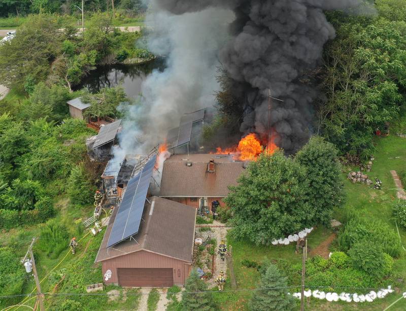 Firefighters respond to a fully-engulfed structure fire in the 500 block of North 2782nd Road on Monday, July 21, 2025 in La Salle. FIre departments from Utica, Wallace, Naplate, Spring Valley, Mendota, Troy Grove, La Salle, Peru, Oglesby and Tonica responded to the scene. Fire crews were dispatched at 9:45 a.m. La Salle Police and La Salle County Sheriff were also on the scene.