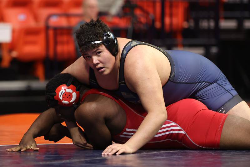 IC Catholic Prep’s works over Isaiah Gonzalez Mooseheart’s Joshua Gaye in the Class 1A 285lb. semifinals at State Farm Center in Champaign. Friday, Feb. 18, 2022, in Champaign.