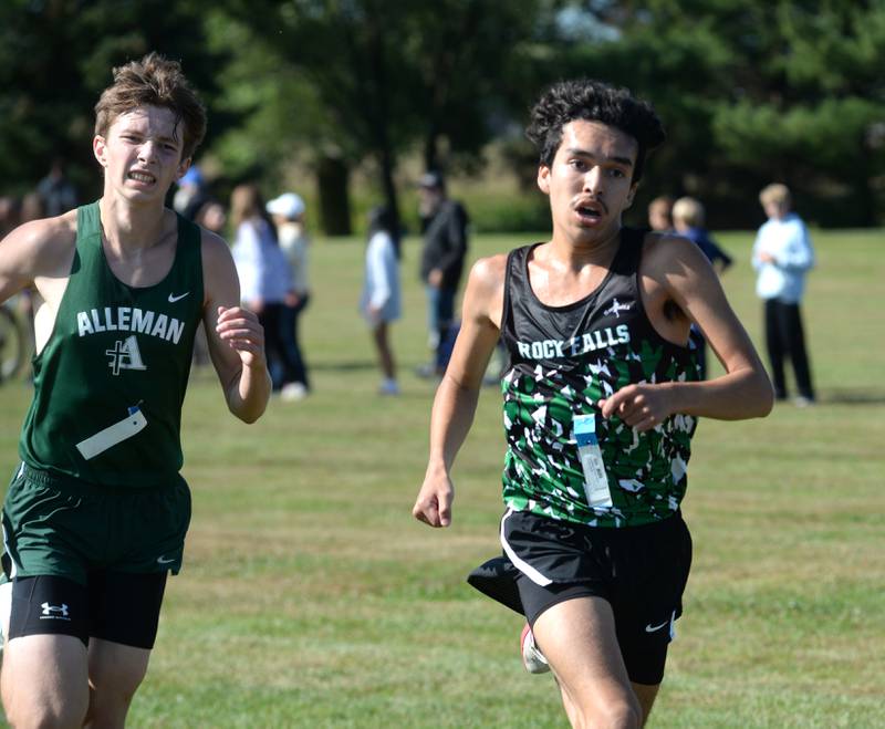 Rock Falls' Ian Finney (right) sprints to the finish line of  the Oregon Cross Country  Open on Saturday, Sept. 6, 2025 at Oregon Park West.