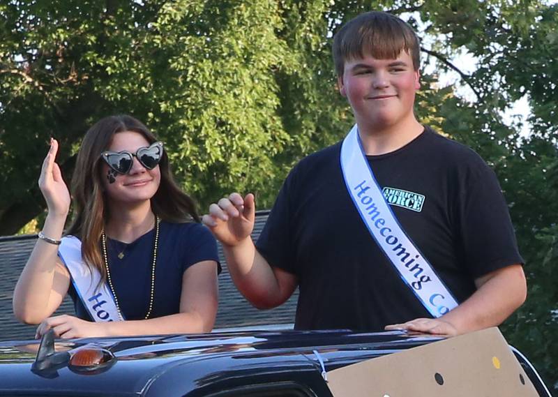 Putnam County High School sophmore court students Sarah Schemmum and Dylan Haycraft ride during the inaugural Homecoming parade on Wednesday, Sept. 17, 2025 down Elm Street in Granville.