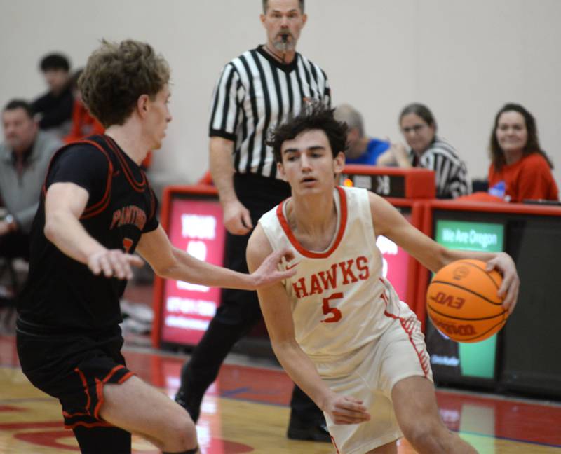 Oregon's Benito Olade (5) makes a move to the basket against an Erie-Prophetstown defender during 2A regional action on Monday, Feb. 24, 2025 at the Blackhawk Center in Oregon.