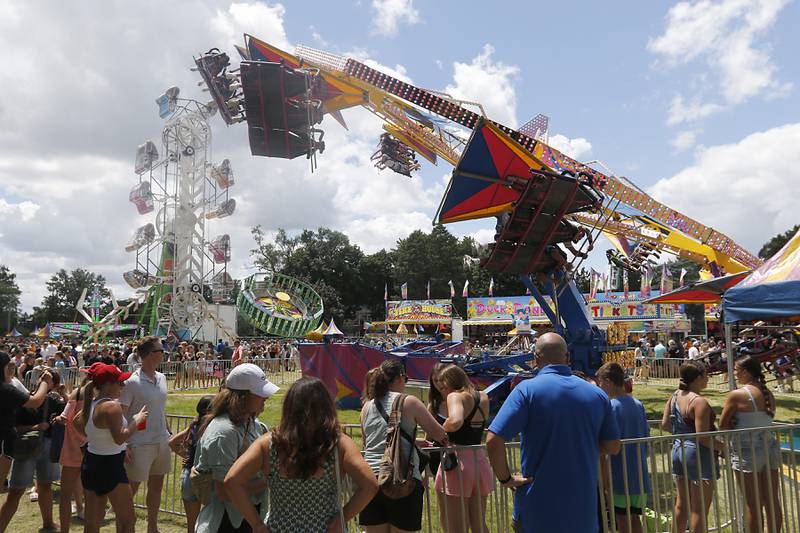 People wait to ride on the rides during Lakeside Festival on Friday, July 5, 2024, at the Dole.