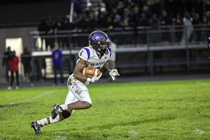 Plano’s Waleed Johnson looks for running room against Dixon Friday, Oct. 27, 2023 in Dixon.