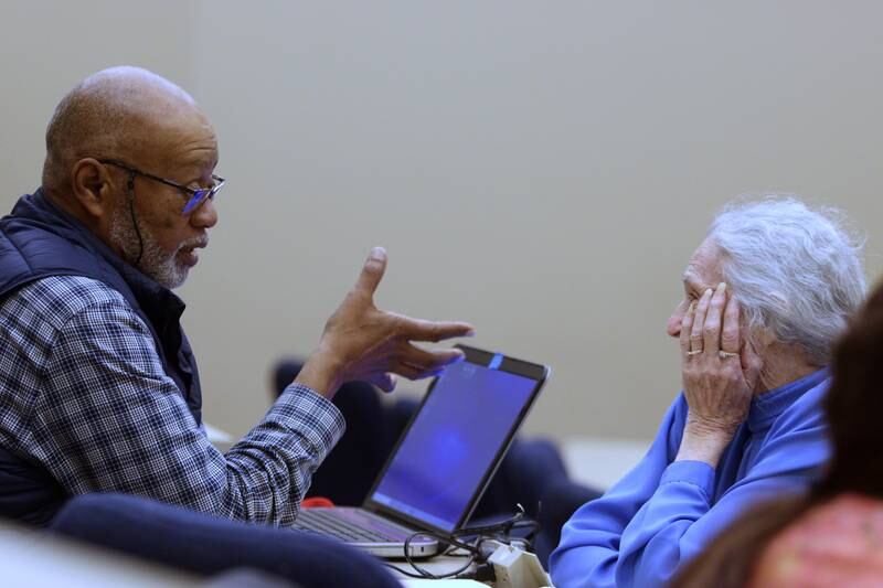 Marti Swanson, right, of Ringwood visits with Jerry Johnson of Cary during a meeting of the McHenry County Illinois Genealogical Society on Thursday, March, 9, at McHenry County College. Thursday was the group’s first in-person meeting since before the pandemic.