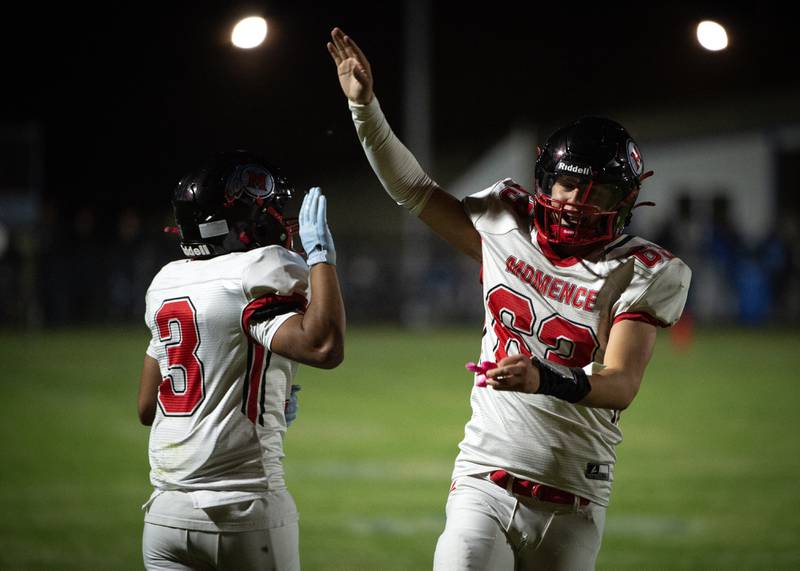 Momence's Jackson Ford, right, celebrates with Eddie Ferreira, left, after Ferreira's touchdown in the 2nd quarter of a game against Clifton Central on Friday, September 5, 2025.