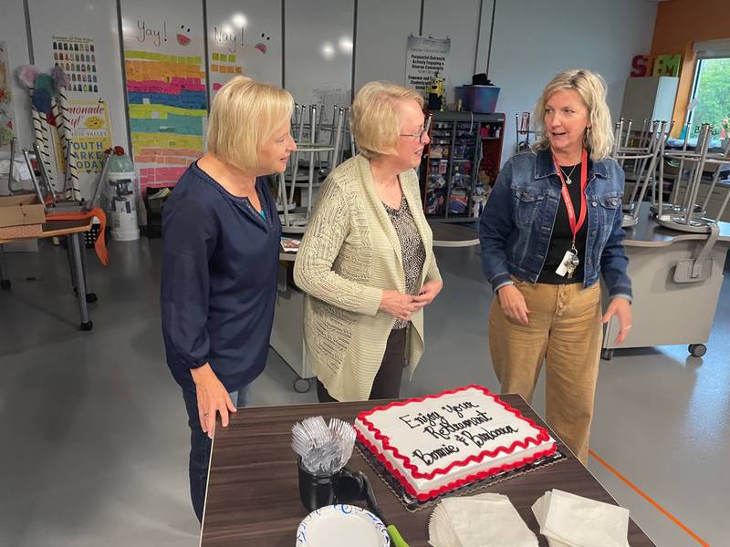 Waltham Superintendent Kristi Eager (right) congratulates retiring bookkeeper Bonnie Kinzer (left) and retiring treasurer Barbara Doherty (center) at the board of education meeting Wednesday, Sept. 20, 2023.