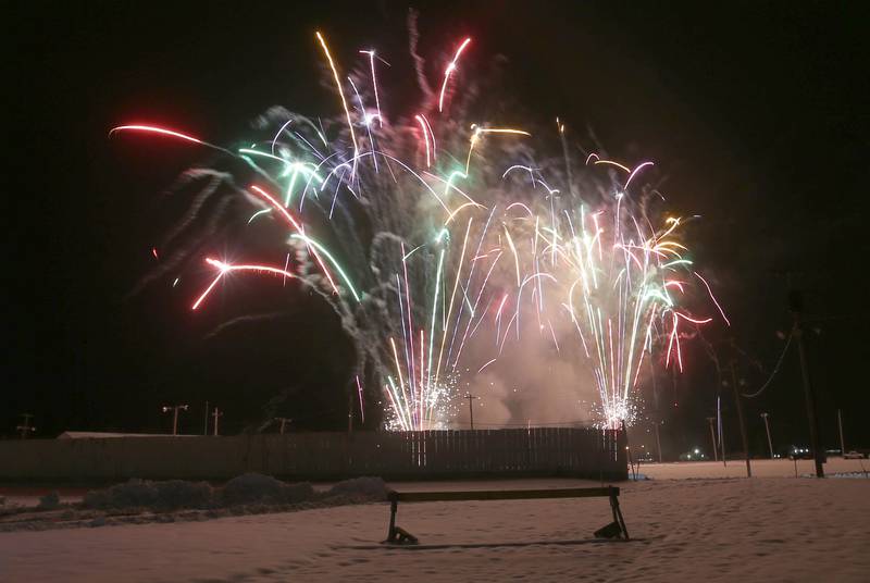 Fireworks fill the sky above Santa Claus during the Christmas Fireworks Spectacular on Saturday, Dec. 6, 2025 at the Bureau County Fair in Princeton.