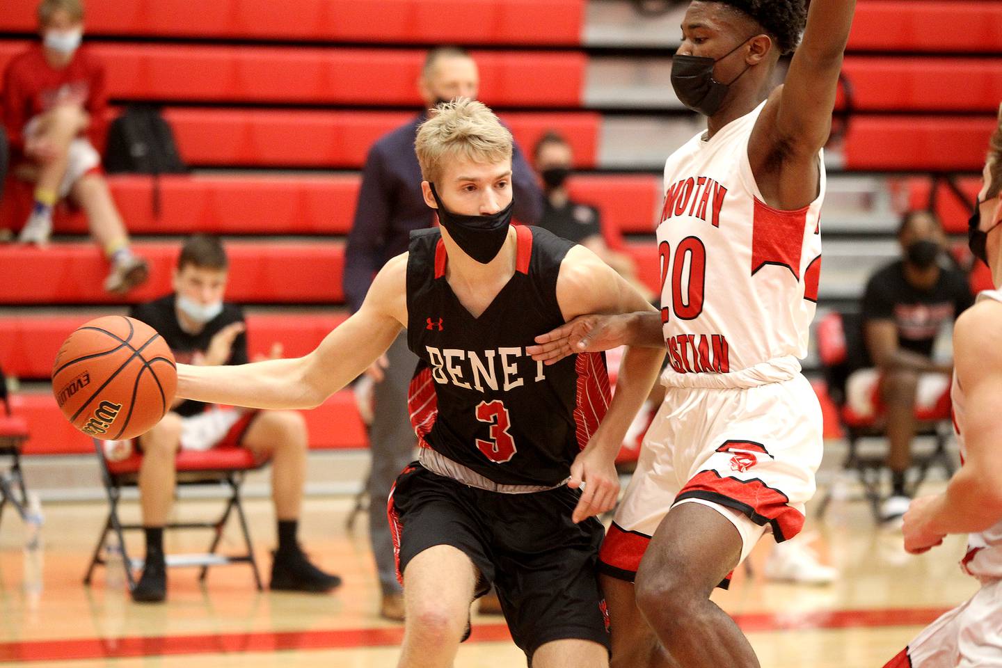 Benet's Tyler Van Eekeren (3) tries to get around Timothy Christian's Josh Harris during a game at Timothy Christian in Elmhurst on Friday, March 12, 2021.