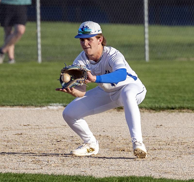 Newman’s Garet Wolfe fields a ball at third base against Rock Falls Wednesday, April 23, 2025.