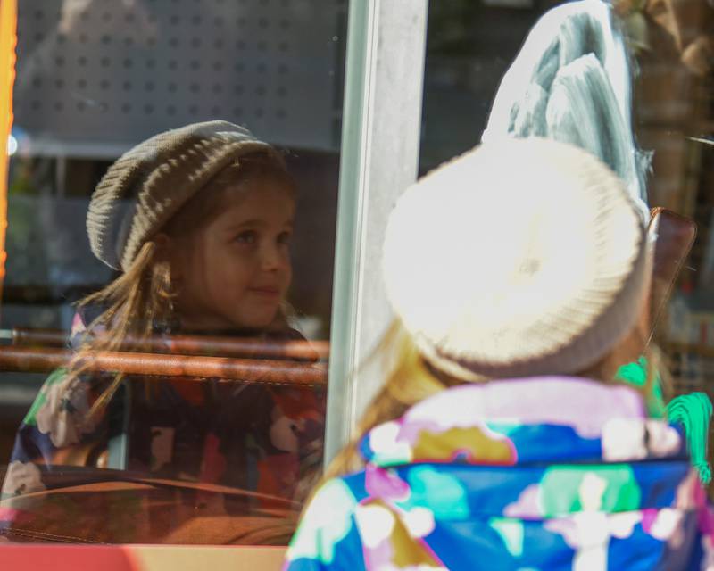Amelia Blackley, 4, of La Grange paints a window on Saturday Oct. 26, 2024, in downtown Downers Grove during a Halloween event.