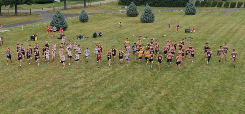 An aerial view of the varsity boys race as it kicks off during the Gary Coates Invitational cross country meet on Saturday, Sept. 13, 2025 at Zearing Park in Princeton .