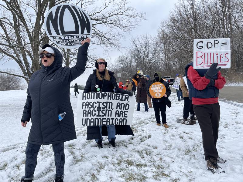 Protesters gather on Saturday, Feb. 25, outside of the Holiday Inn in Crystal Lake, to protest a speaking event featuring conservative activist Charlie Kirk.