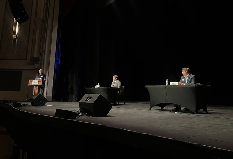Sauk Valley Community College President Dave Hellmich (left) poses questions for candidates Brad Fritts (left middle), R-Dixon, and David Simpson (right), D-Shabbona, Tuesday night as they campaign to represent the 74th District in the Illinois House of Representatives.