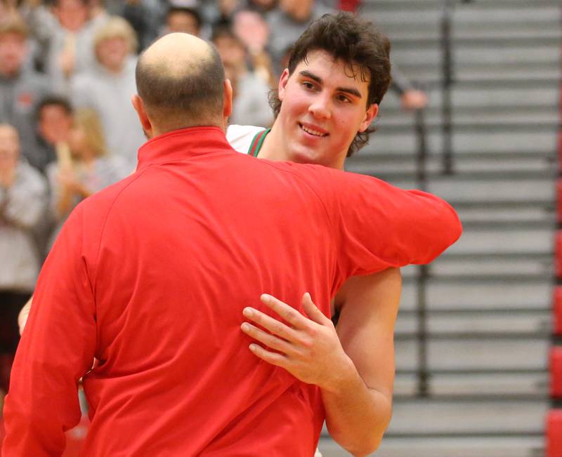 L-P"s Josh Senica gets a hug from his father and head coach John Senica after scoring 1000 points on Tuesday, Nov., 28, 2023 in AJ Sellett Gymnasium at L-P High School.