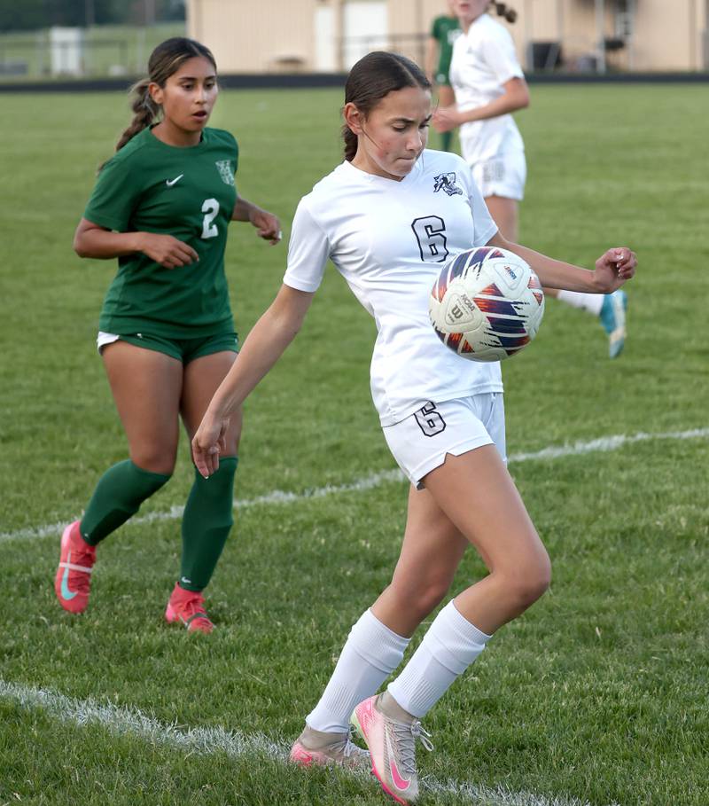 Kaneland's Taylor Mills tries to keep the ball inbounds in front of Boylan's Betsy Millan Wednesday, May 28, 2025, during their Class 2A sectional semifinal game at Belvidere High School.