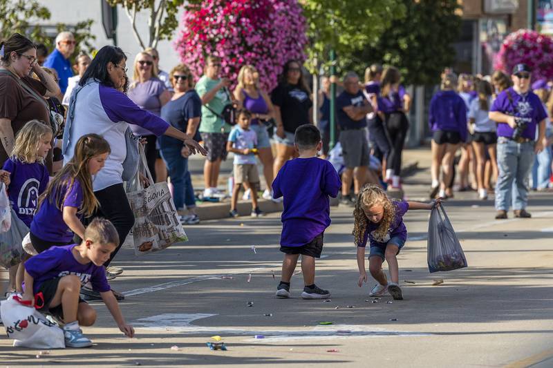 Kids scoop up candy Friday, Oct. 3, 2025, during Dixon’s homecoming parade.