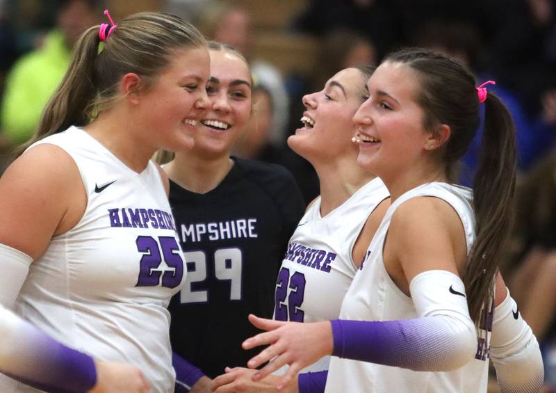 Hampshire’s Whip-Purs celebrate a point in girls varsity volleyball at Huntley High School on Thursday, October 23, 2025.