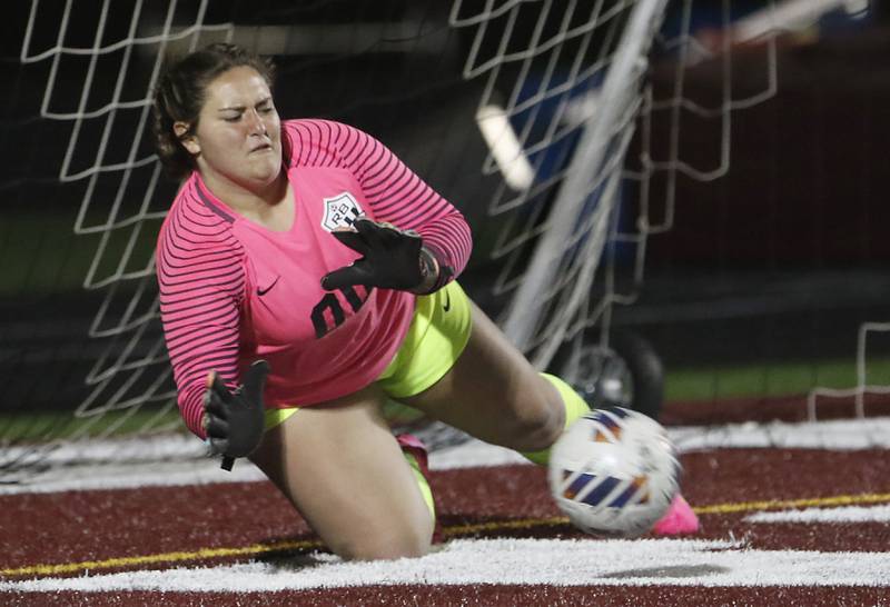 Richmond-Burton's Taylor Labay stops the kick of Johnsburg's Elizabeth Smith in the shoot-out to win the Kishwaukee River Conference Girls Soccer Tournament Championship Match Wednesday, May 3, 2023, at Richmond-Burton High School.