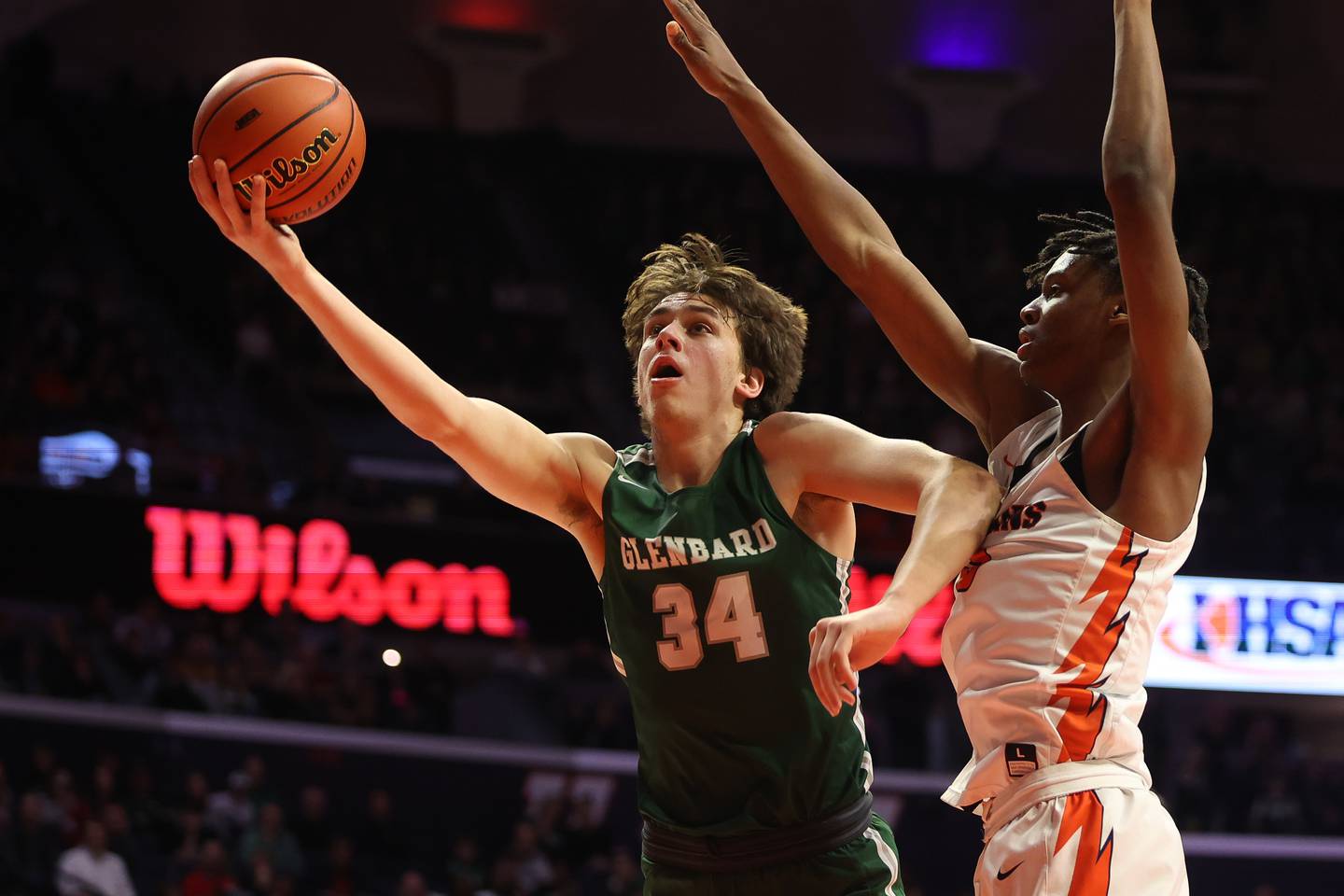 Glenbard West’s Braden Huff lays in a shot against Whitney Young in the Class 4A championship game at State Farm Center in Champaign. Saturday, Mar. 12, 2022, in Champaign.