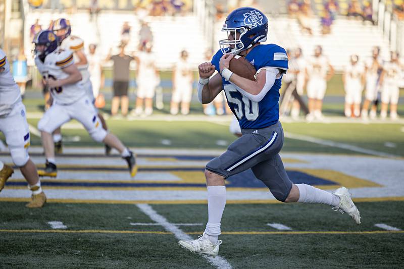 Newman’s Daniel Kelly runs back an interception against Sherrard Saturday, Sept. 2, 2023 in a game at Sterling High School.