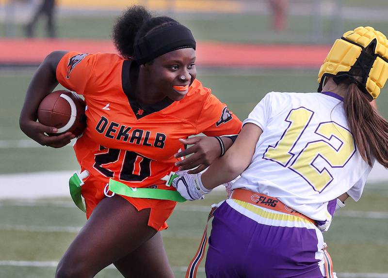 DeKalb's Kenya Alexander tries to avoid a tackler Monday, Aug. 25, 2025, during their game against Belvidere at DeKalb High School. The contest marked the first ever game for the girls flag football program at DeKalb.