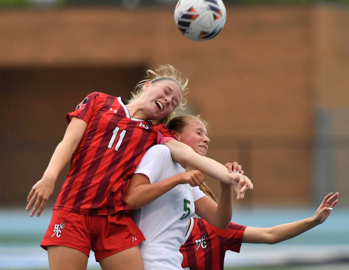 Hinsdale Central’s Peyton Rohn (11) heads the ball over York’s Allie Kocinski during the Class 3A Downers Grove South Sectional final game on May 30, 2025 at Downers Grove South High School in Downers Grove .