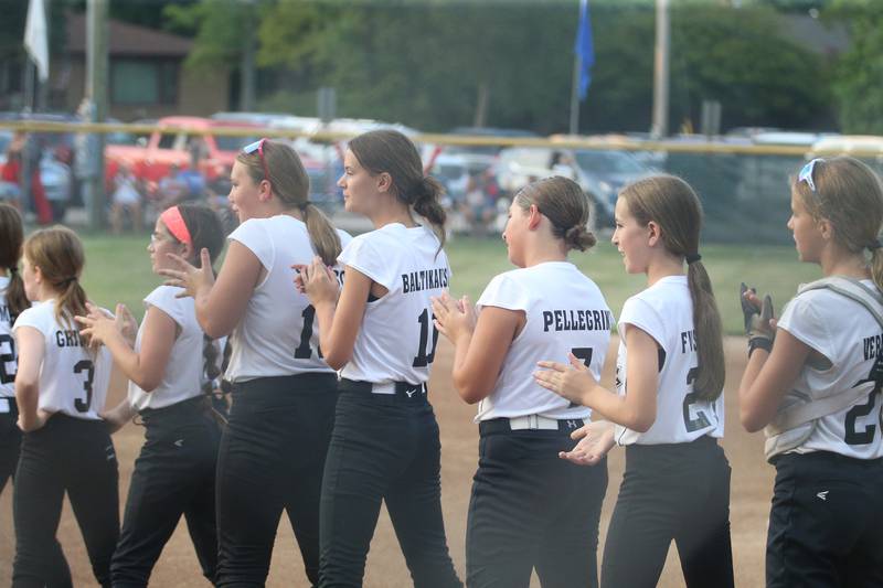 Members of the Spring Valley District 20 softball team line up before the game against Tri-Cities on Tuesday, July 25, 2023 at McKinley Park in Peru.