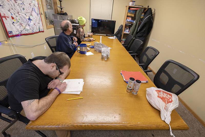 After dinner, Daniel sits down to sketch Wednesday, Jan. 7, 2026, at the PADS Shelter. Daniel uses drawing and music to help cope with stress.