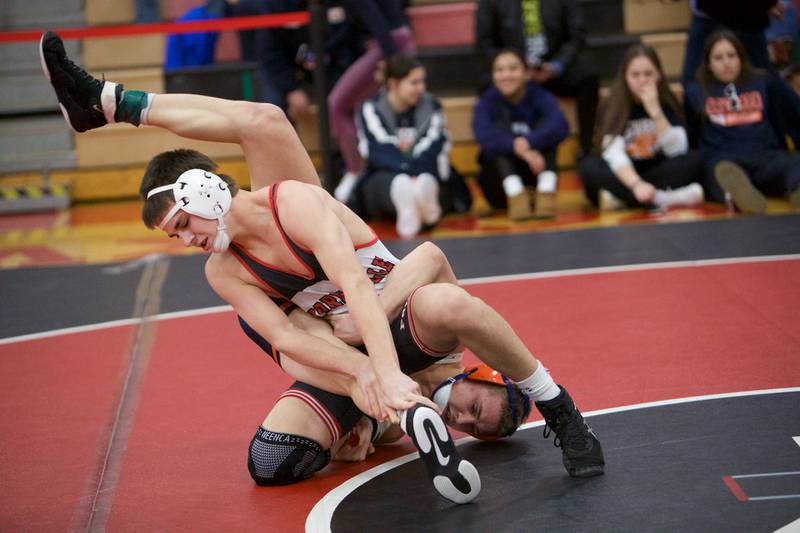 Yorkville's Donovan Rosauer competes with Oswego's Brayden Swanson in the 138 lb. class Final at the Class 3A Regional on Saturday, Feb.3,2024 in Yorkville.