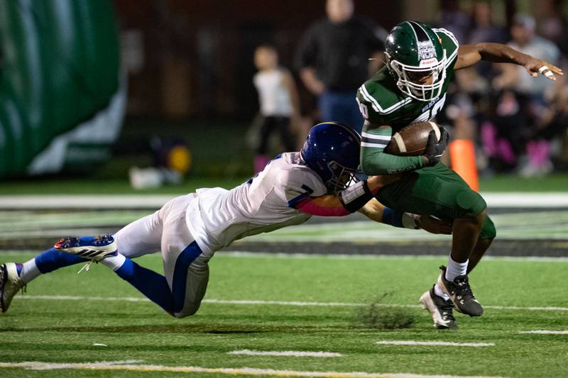 Plainfield Central's Torrance Freeman gets brought down by Joliet Central's Jonas Gregory during a game on Friday Oct. 11, 2024 at Plainfield Central High School