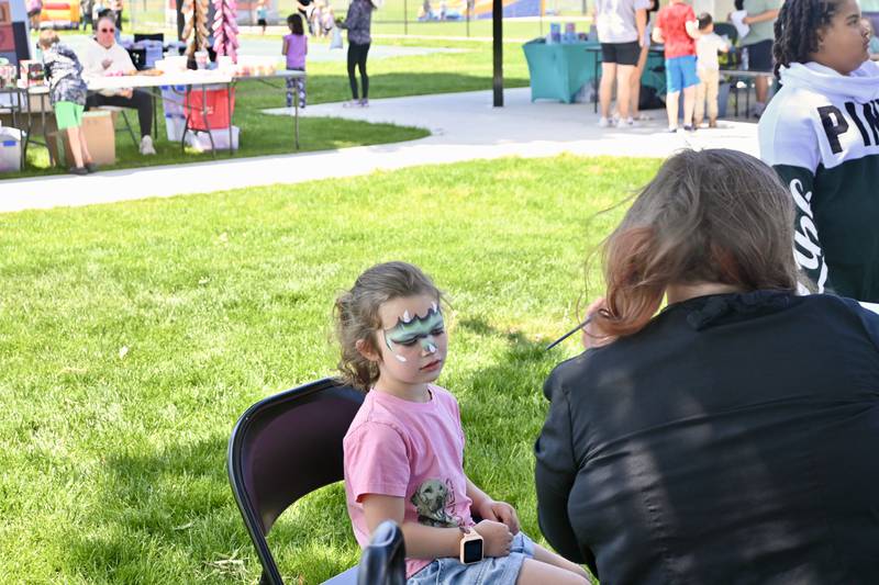 Kinsley Reynolds, 4 , of Somonauk gets her  face painted on Sunday, May 18, 2025 during the  5th annual  Kites in Flight at Peck Park in Ottawa.