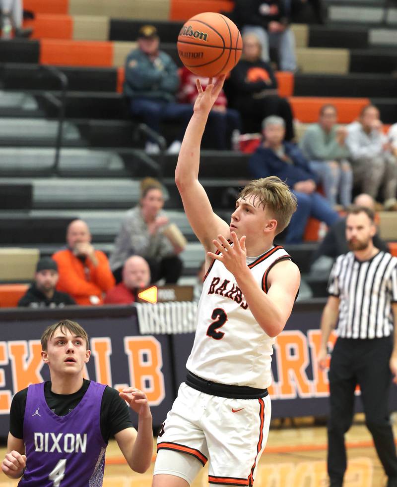 DeKalb’s Sean Reynolds gets off a shot in the lane in front of Dixon's Brady Feit during their game Tuesday, Dec. 12, 2023, at DeKalb High School.