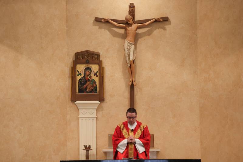 Father Jim Olofson leads mass at Church of St. Anthony on Friday, March 29, 2024 in Joliet.