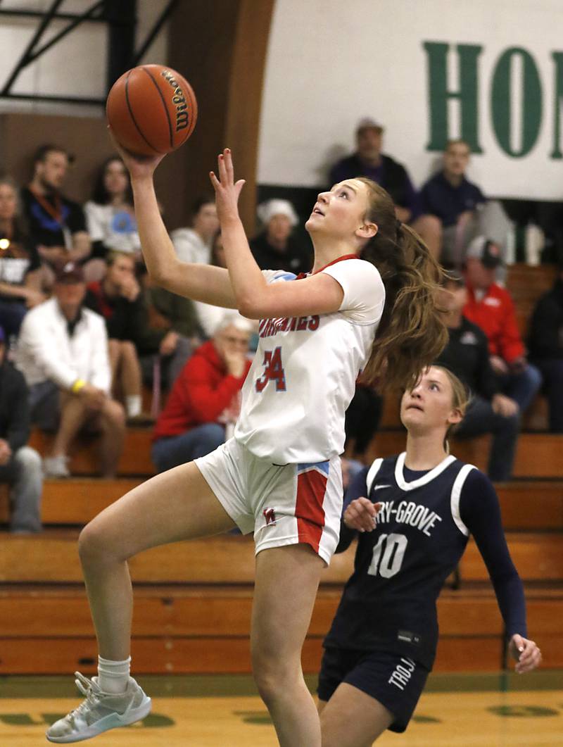 Marian Central's Juliette Huff drives to the basket in front of Cary-Grove's Alivia Nielsen during the girl’s game of McHenry County Area All-Star Basketball Extravaganza on Sunday, April 13, 2025, at Alden-Hebron’s Tigard Gymnasium in Hebron.