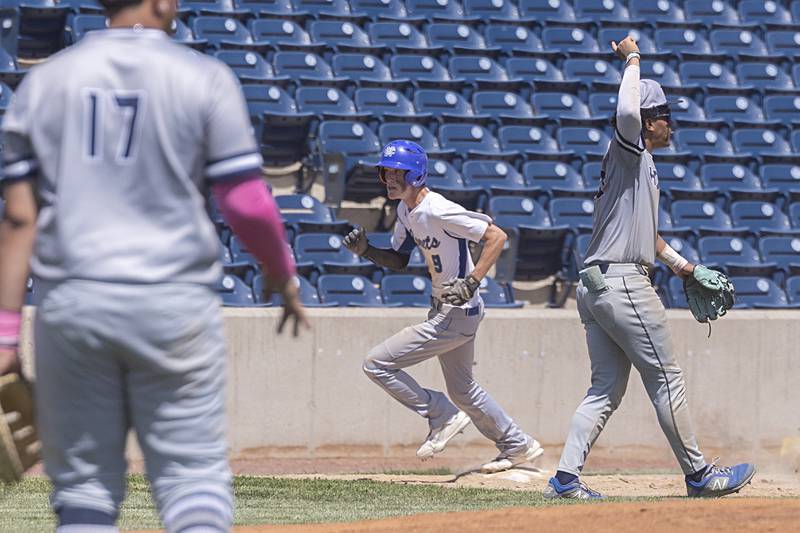 Newman’s Joe Oswalt rounds third to score the eventual game winning run in the super sectional game against Chicago Hope Monday, May 29, 2023.